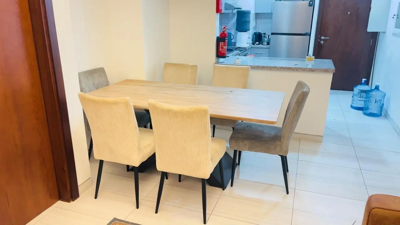 Dining table with upholstered chairs donated in Dubai