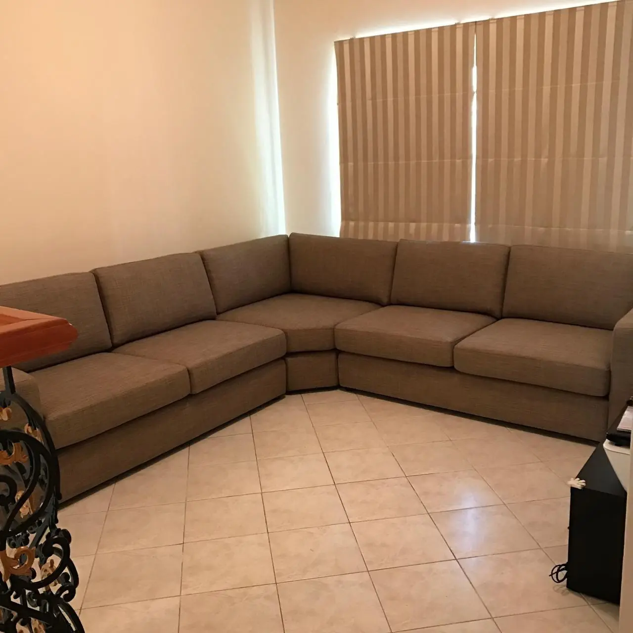 Brown L-shaped sofa donated in Dubai