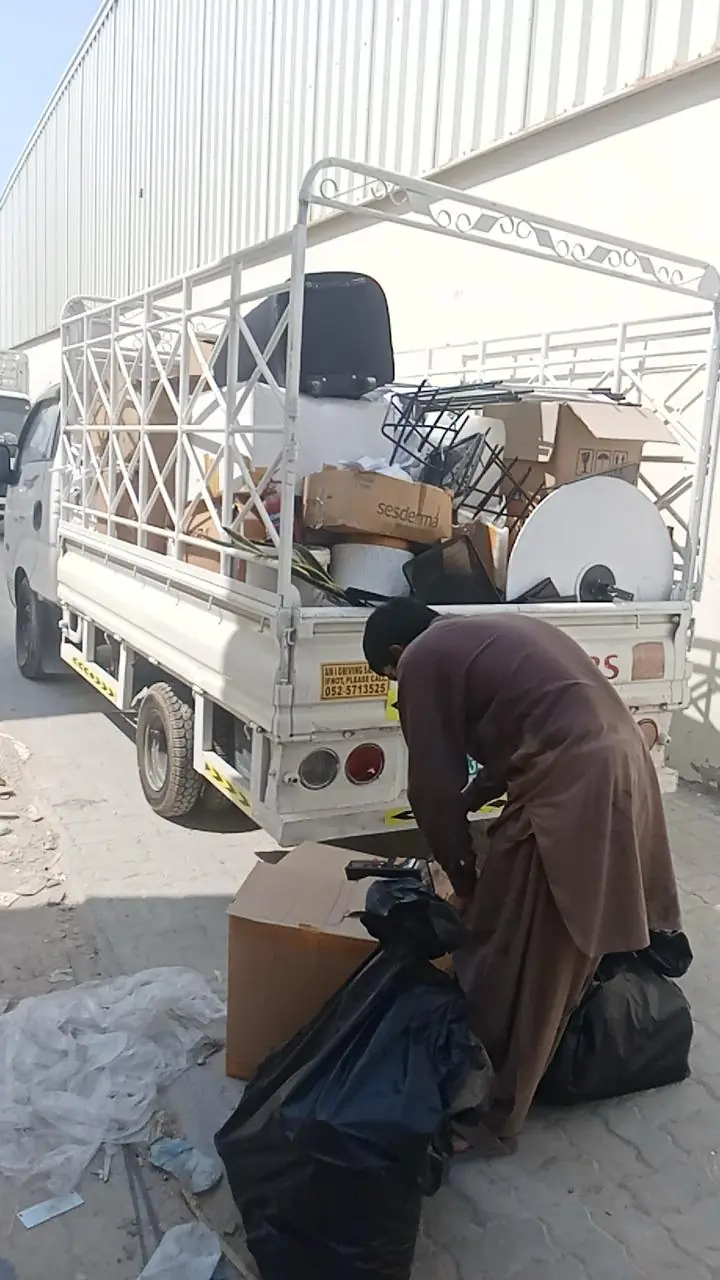 Crew member packing donated items onto the pickup
